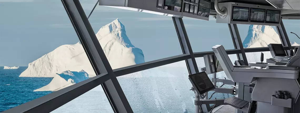 Ship's bridge interior with large, angled glass windows offering a clear view of an iceberg and the ocean.