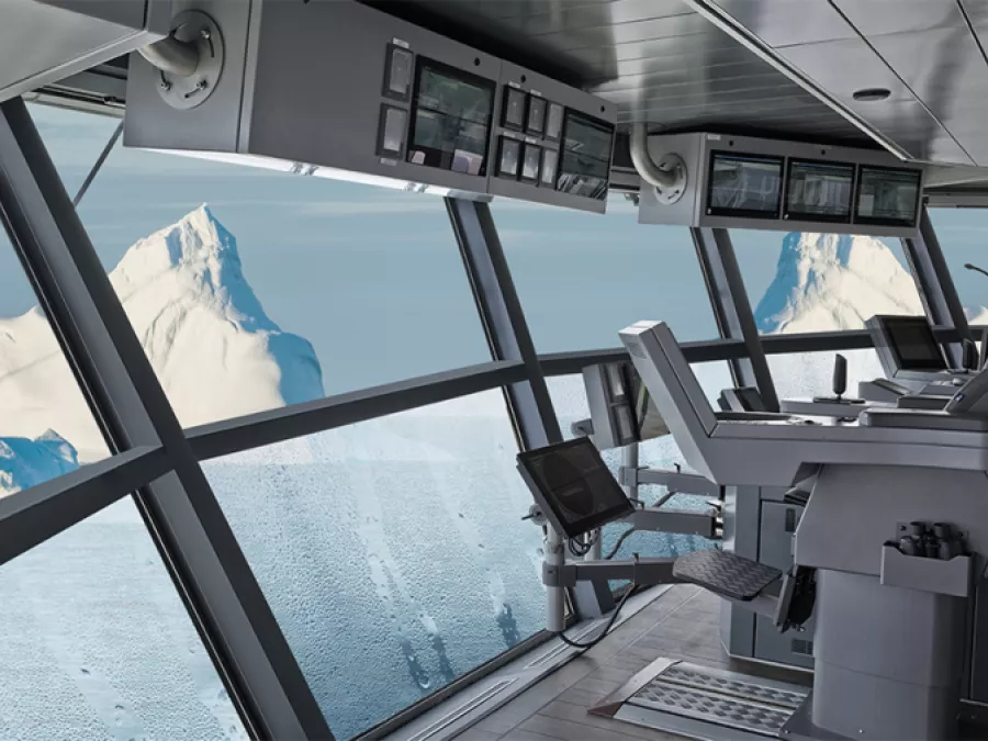 Ship's bridge interior with large, angled glass windows offering a clear view of an iceberg and the ocean.
