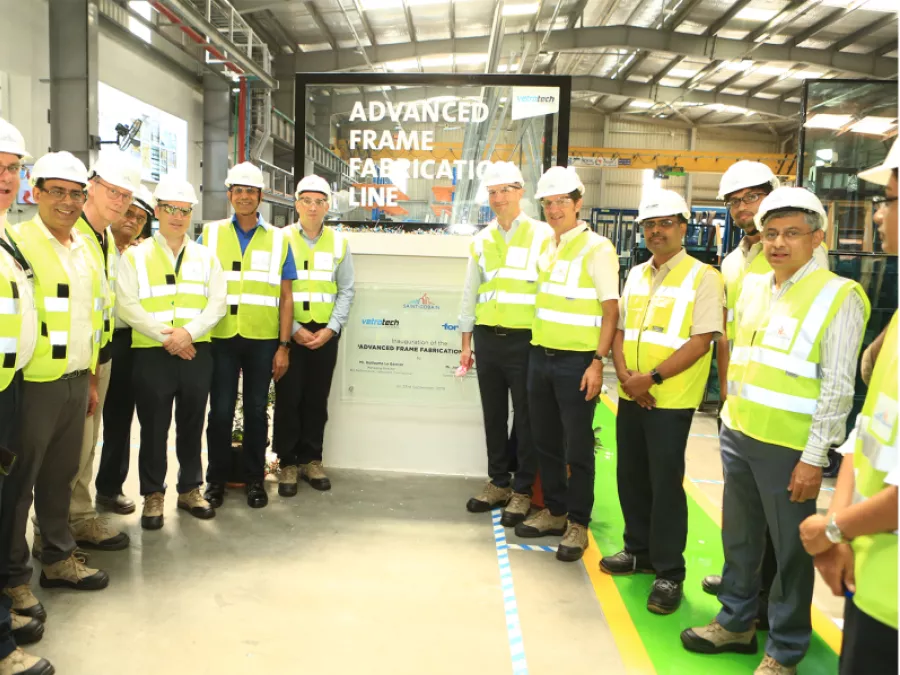 Safety-vested group at the opening of an 'Advanced Frame Fabrication Line' at Vetrotech Mumbai.