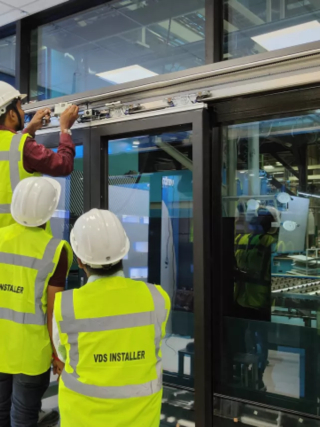 Vetrotech VDS certified installers installing a fire-rated system.