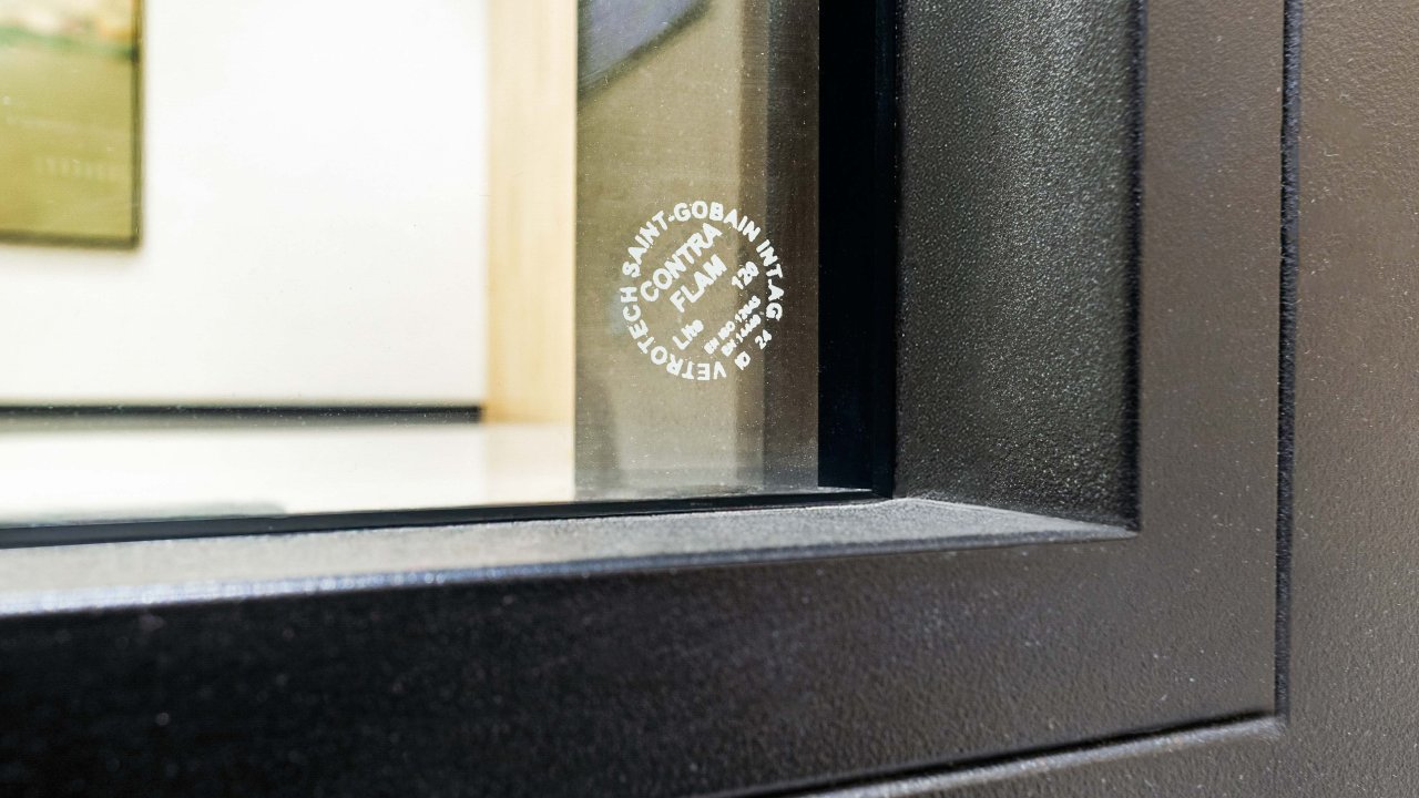Fire-resistant CONTRAFLAM Vetrotech glass in a black metal frame at a Brookfield property